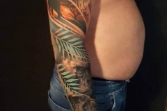 tatuaje-leon-girafa-gorila-animales-brazo-realismo-christian-kurt-bieber-inferno-tattoo-barcelona