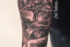 inferno-tattoo-barcelona-realismo-negro-y-gris-joel-federico-bieber-grande-brazo-antebrazo-retrato-jose-merce-flamenco-cantador